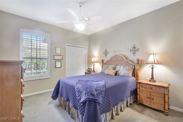 bedroom with a closet, ceiling fan, and carpet