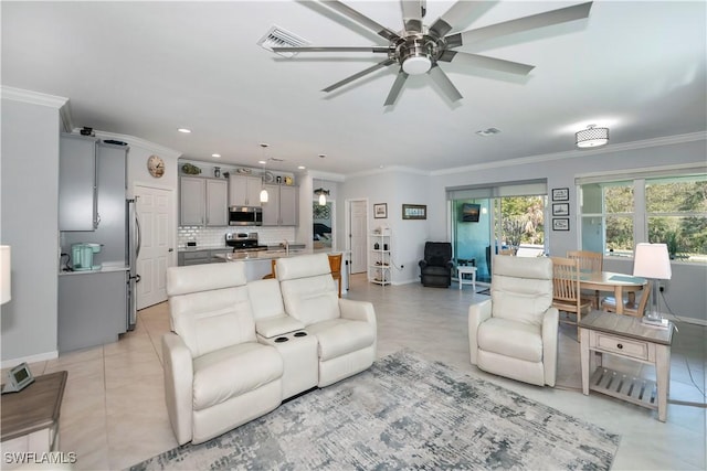 living room with crown molding and light tile patterned floors