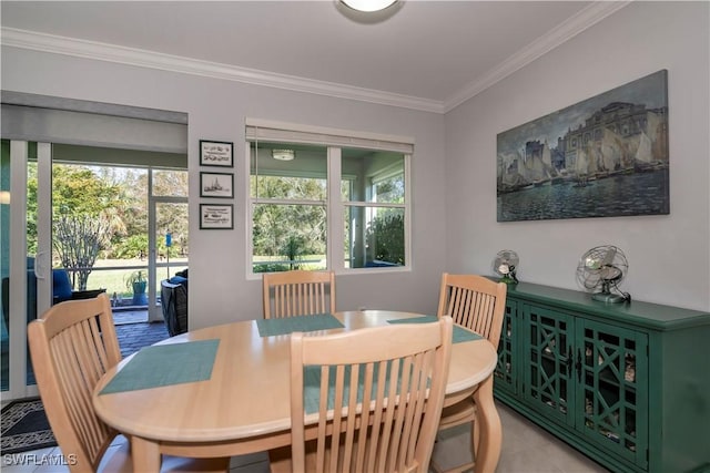 dining area with a healthy amount of sunlight and crown molding