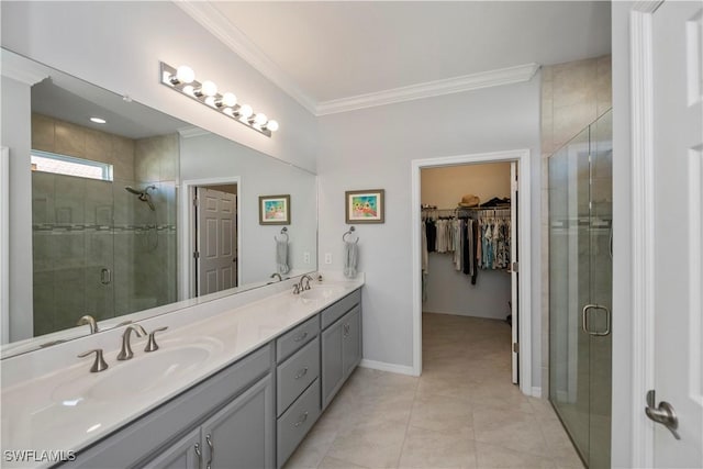 bathroom featuring tile patterned floors, vanity, an enclosed shower, and ornamental molding