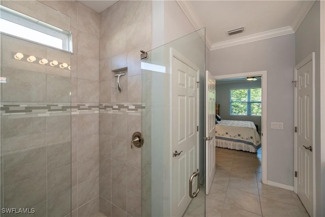 bathroom featuring tile patterned flooring, an enclosed shower, and ornamental molding