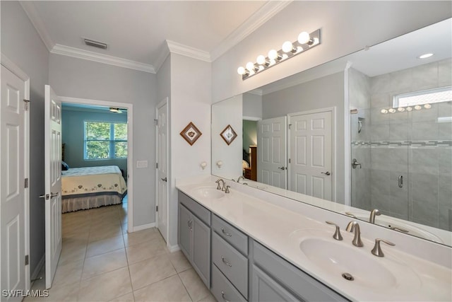 bathroom with tile patterned flooring, vanity, an enclosed shower, and crown molding