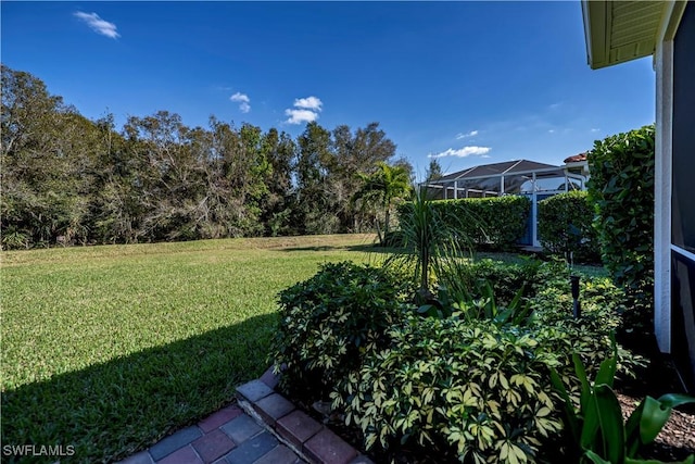 view of yard with a lanai