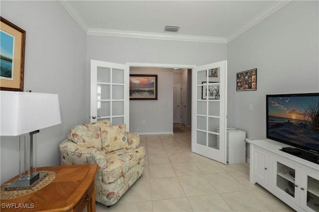 living room featuring light tile patterned floors, crown molding, and french doors