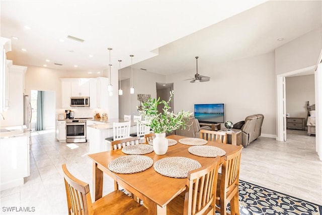 dining space with a ceiling fan, recessed lighting, baseboards, and light tile patterned floors