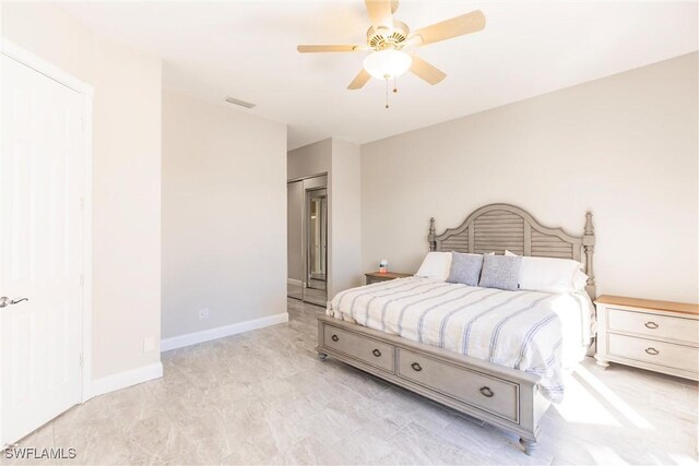 bedroom with visible vents, baseboards, and a ceiling fan