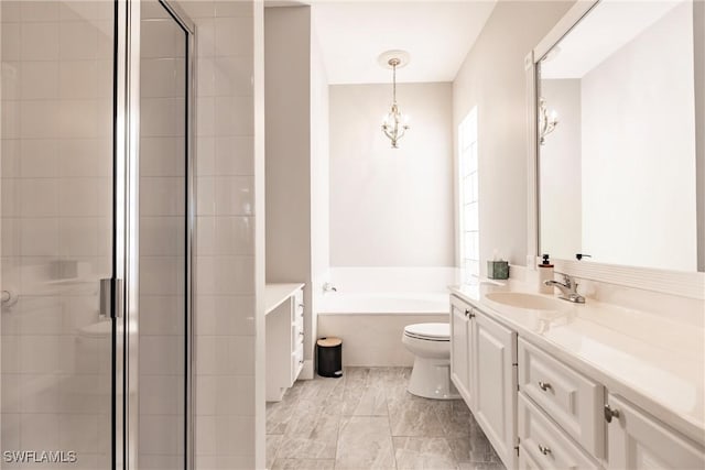 bathroom with toilet, a stall shower, a garden tub, and vanity