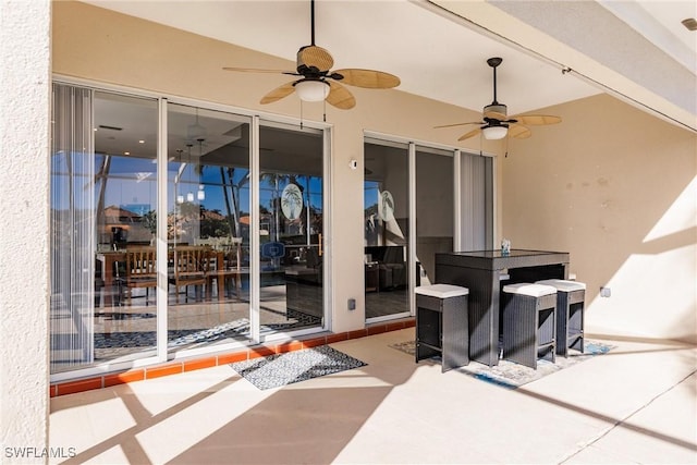 view of patio featuring a ceiling fan and outdoor dining space