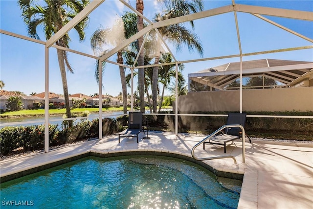 pool with a lanai and a patio area