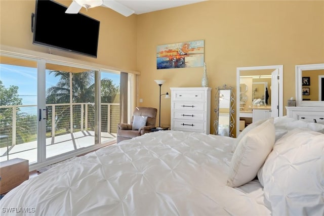 bedroom with ceiling fan, access to exterior, and multiple windows