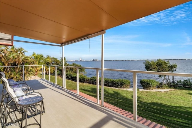 balcony featuring a water view