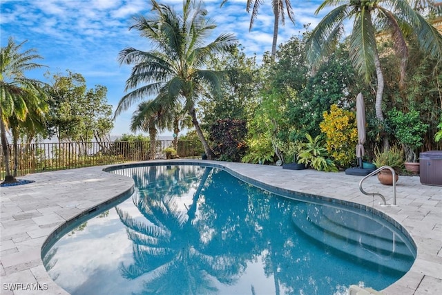 view of swimming pool featuring a patio area