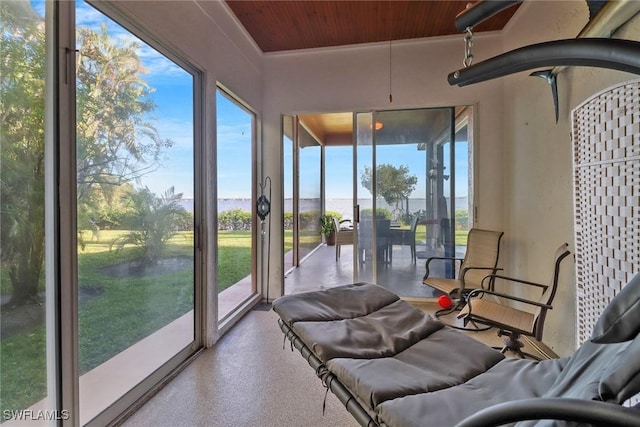 sunroom featuring wooden ceiling