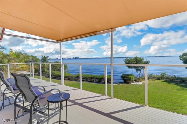 balcony featuring a water view