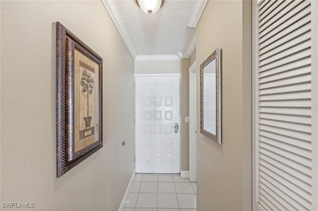 hall with crown molding, light tile patterned flooring, and a textured ceiling