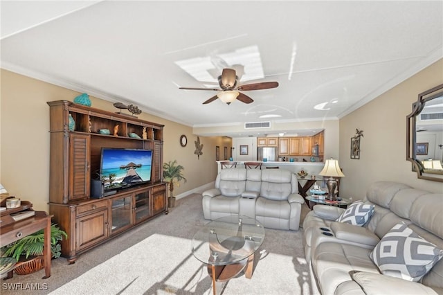 carpeted living room featuring ceiling fan and ornamental molding