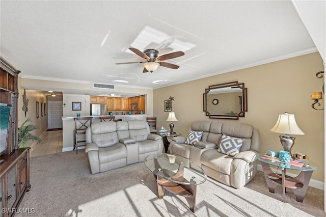 living room featuring light carpet, ceiling fan, and crown molding