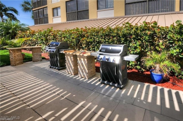 view of patio featuring a grill