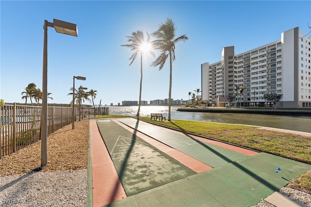 view of community with a water view