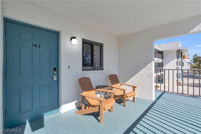 entrance to property with a balcony