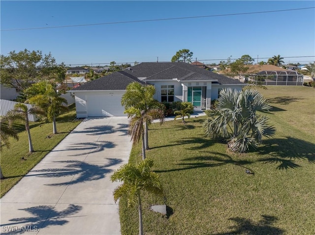 view of front of house featuring a front lawn and a garage