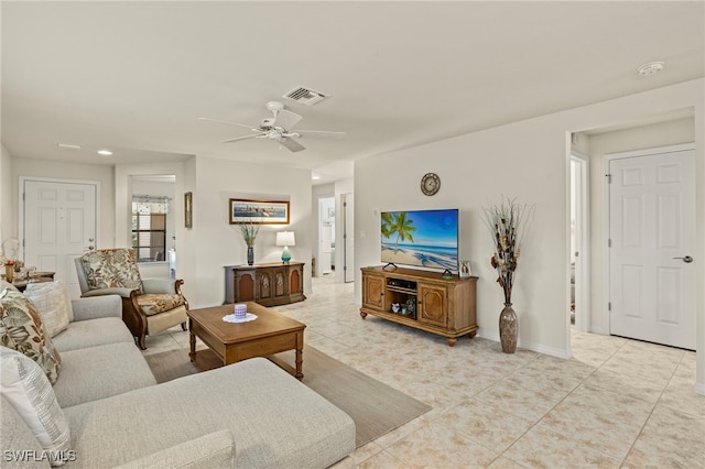 living room featuring ceiling fan and light tile patterned floors