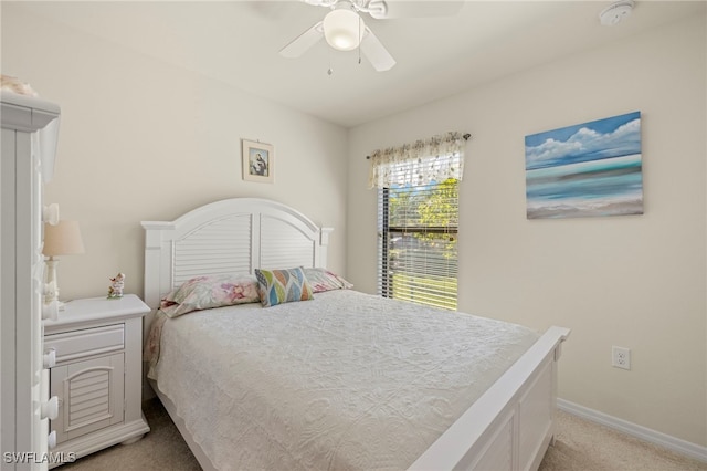 bedroom featuring light carpet and ceiling fan