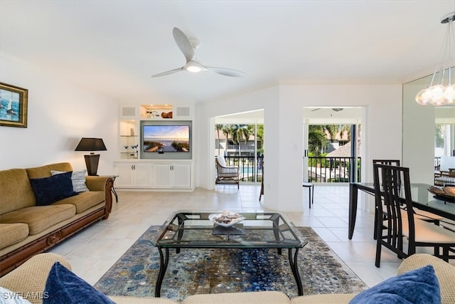 tiled living room with ceiling fan and plenty of natural light