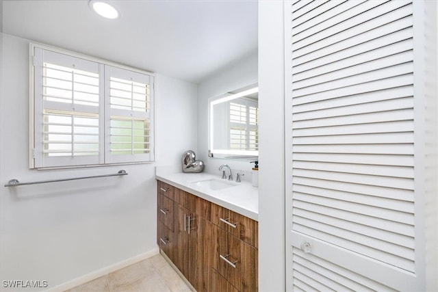 bathroom featuring tile patterned floors and vanity