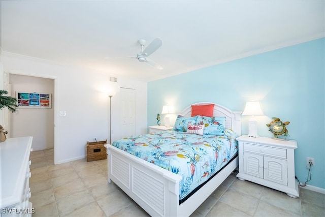 bedroom with ceiling fan, a closet, and crown molding