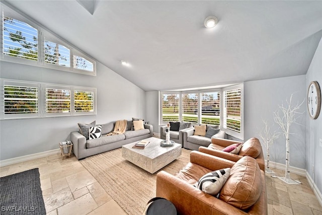 living room featuring vaulted ceiling