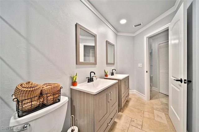 bathroom with vanity, toilet, and crown molding