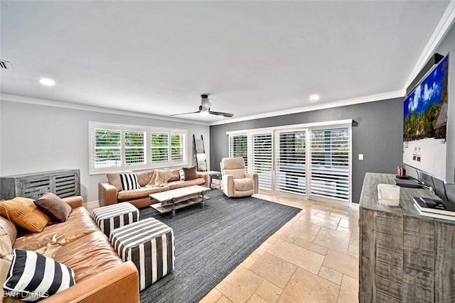 living room featuring ceiling fan and crown molding