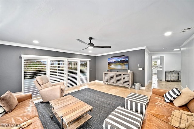 living room featuring ceiling fan and ornamental molding