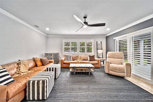 living room with ceiling fan and crown molding