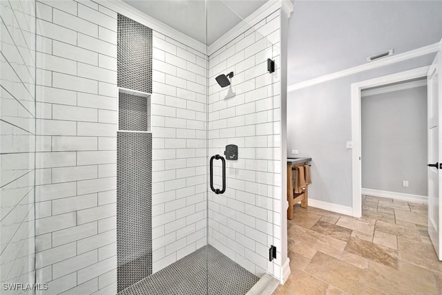 bathroom with vanity, walk in shower, and ornamental molding