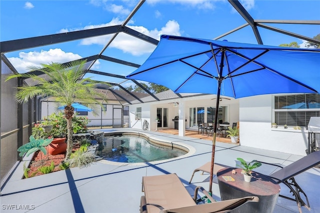 view of pool with a lanai, a patio area, and ceiling fan