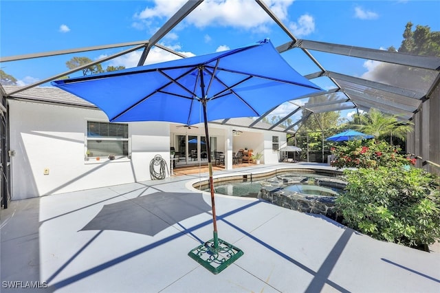 view of swimming pool featuring an in ground hot tub, a patio, and glass enclosure