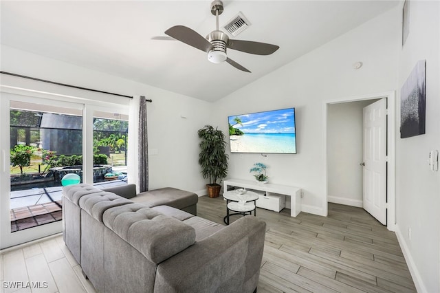 living room featuring ceiling fan, high vaulted ceiling, and light hardwood / wood-style floors