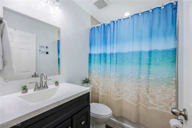 full bathroom featuring tile patterned flooring, vanity, toilet, and shower / tub combo with curtain