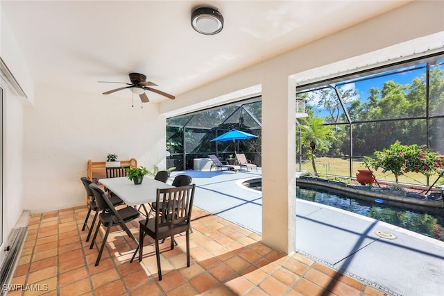 view of patio featuring ceiling fan and a lanai