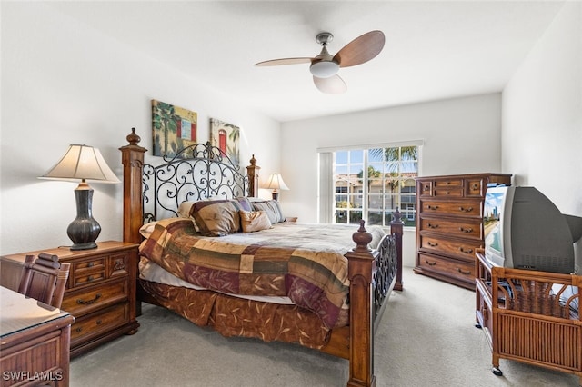 bedroom featuring light carpet and ceiling fan