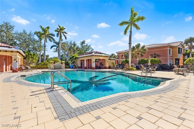 view of swimming pool featuring a patio area