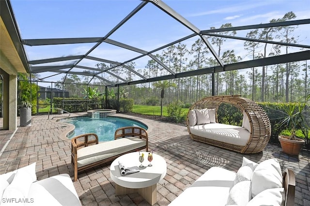 view of patio featuring glass enclosure, a pool with connected hot tub, and an outdoor hangout area