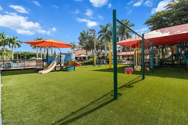 communal playground featuring a yard