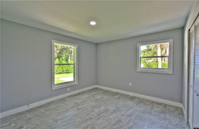 spare room with a wealth of natural light