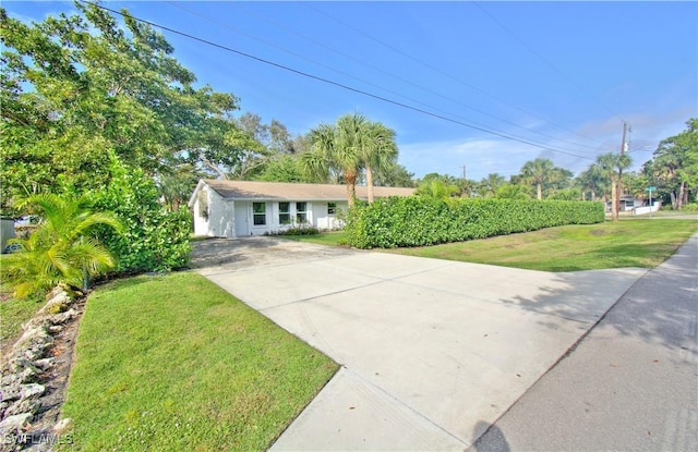 ranch-style home with a front yard