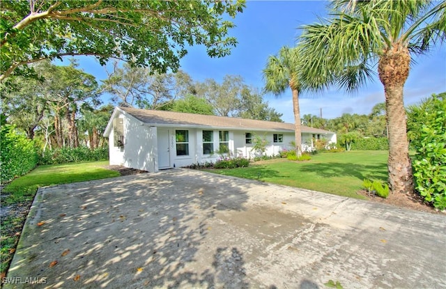 ranch-style house with a front yard