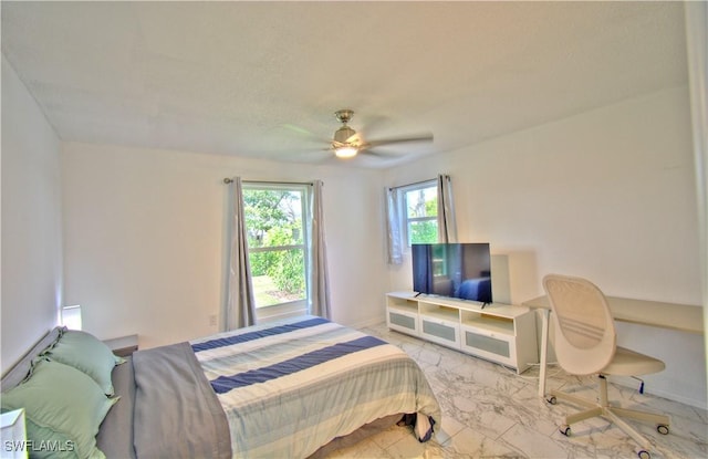 bedroom featuring ceiling fan