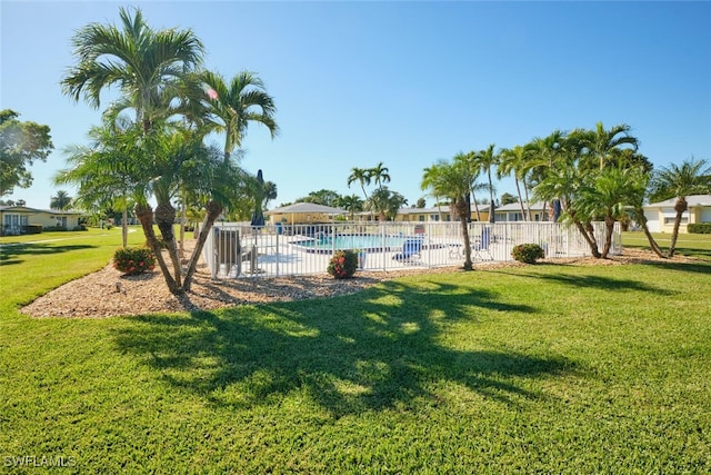 view of yard featuring a community pool